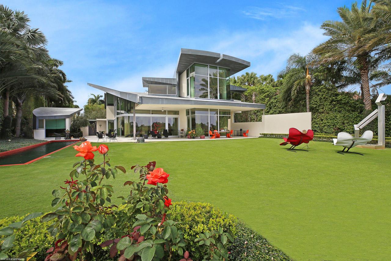 Step into the epitome of luxury living with this stunning Frank Israel designed home, nestled on one of the most coveted Intracoastal lots in Northern Palm Beach County. Offering unrivaled privacy against the backdrop of rare barrier island and preserve views, this residence is a sanctuary of serenity. This exclusive property presents an unparalleled opportunity for discerning individuals seeking the ultimate in waterfront living. Whether you're captivated by the allure of this exquisite home or envisioning the creation of your own bespoke masterpiece in the prestigious gated enclave of Admirals Cove, the possibilities are as limitless as the breathtaking vistas that surround you. Every aspect of this estate exudes opulence and sophistication.