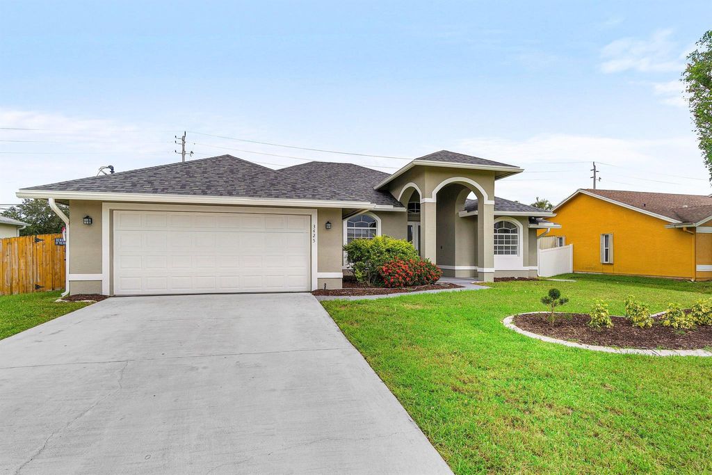 Photo of 3425 SE Bevil Avenue, Port Saint Lucie, FL 34984 (MLS # R11120630)