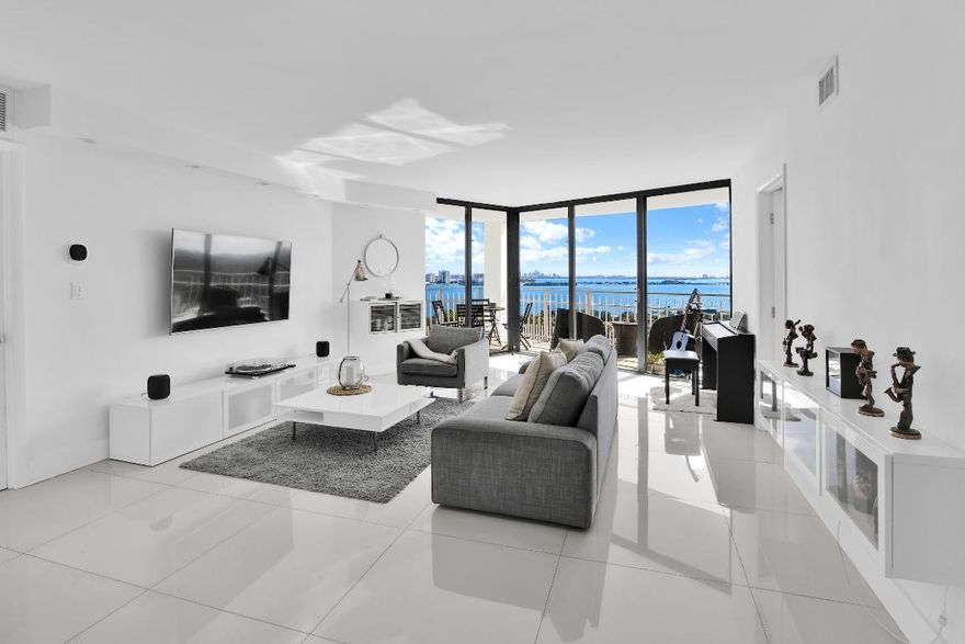 Exceptional 18th-floor residence offering breathtaking bay views from every room. This stunning 2-bedroom condo features a beautifully remodeled open floor plan with porcelain floors throughout, a spacious primary bathroom with dual sinks, and seamless access to a generous balcony—perfect for outdoor dining and entertaining. The split-bedroom layout provides privacy, with each bedroom offering its own en-suite bathroom. Unit is offered unfurnished only. Residents enjoy resort-style amenities including a 24-hour attended lobby, manned gate, pool and hot tub, state-of-the-art fitness center, fully equipped social rooms, tennis courts, barbecue areas, and more.