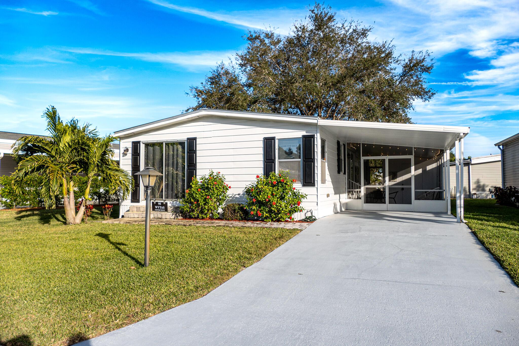 95 North Warner Drive is located in the 55+ community of Pinelake Village in Jensen Beach and is a charming home that comes completely furnished. This 1,200 square-foot home features 2 bedrooms and 2 bathrooms, offering a cozy and comfortable living space. Built in 1978, the home exudes a classic charm with its well-maintained structure and inviting atmosphere. AC is 2023 and has a 10-year warranty. Roof is only 4 years old. New vapor barrier, stainless steel appliances. Irrigation system runs on well water to keep the cost of water low. Lot rent is only $724 per month and includes cable, trash removal, recycling and all the amenities of the clubhouse. A peaceful environment, perfect for folks looking for a tranquil retreat. 95 North Warner is an ideal place to call home.