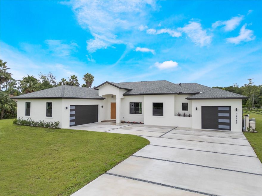 Experience modern living in the heart of Loxahatchee with this 2025 new construction on a 1-acre lot offering 4 beds, 2 full & 2 half baths. Inside features sleek Bosch appliances, a built-in barista station, and bar area for entertaining. Step outside to a screened-in patio with outdoor kitchen hookups, cabana bath, and outdoor shower — perfect for your future pool or backyard oasis. Includes 2-car + 1-car garage with 240 EV outlets, whole-home water softener, and outdoor lighting. Conveniently located near Westlake, shopping, dining, and top-rated schools. Vacant and easy to show!