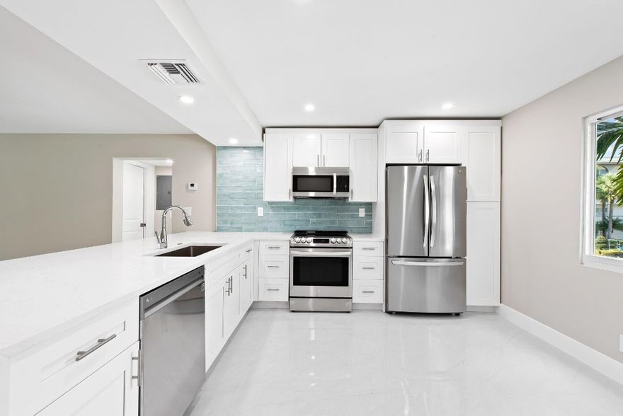 This is your opportunity to own the largest and most luxurious unit available in Wynmoor!  This rarely available corner unit has over 1570 Sqft of perfection.  Garden view, lakeview and golf course view all from the comfort of your living room.  New impact rated windows and doors, a meticulously and masterfully designed kitchen with brand new high end stainless steel appliances, new energy efficient air conditioner, water heater, bathrooms, frameless shower doors and the list goes on and on.  This unit has been completely remodeled from floor to ceiling with permits.  The Wynmoor Village community was voted #3 in the Country for community living and offers an 18 hole Golf Course and Country Club along with the best resort styled amenities for the active senior lifestyle. The Wynmoor Country Club hosts various classrooms dedicated to specific art forms, catering to the residents of Wynmoor. Among the facilities available at the Country Club are the Stained Glass Studio, Wood Shop, Glass Kiln Studio, Ceramics Studio, Painting Studio, and Stone/Clay Sculpture Studio.Additionally, the Country Club offers amenities such as a Library, two Card Rooms, a spacious Pool and Billiards Room, a Lecture Hall equipped with 175 fixed seats and a stage, and three Ballrooms. These Ballrooms can be combined to create a large Grand Ballroom, suitable for hosting a variety of events and functions. Residents have the option to rent the Lecture Hall and Ballrooms for their specific needs.Cafe on the Green provides residents with scenic views of our Golf Course and is conveniently located adjacent to our Golf Shop. On the Country Club patio, residents can enjoy additional amenities such as barbecues, a picnic area, and vending machines.Wynmoor boasts over 70 clubs designed for the enjoyment of our residents. Our community is vibrant and diverse, offering a wide range of planned activities from A to Z. Whether it's civic engagement, social gatherings, educational pursuits, sports-oriented activities, hobbies, and beyond, the variety of options is truly impressive.