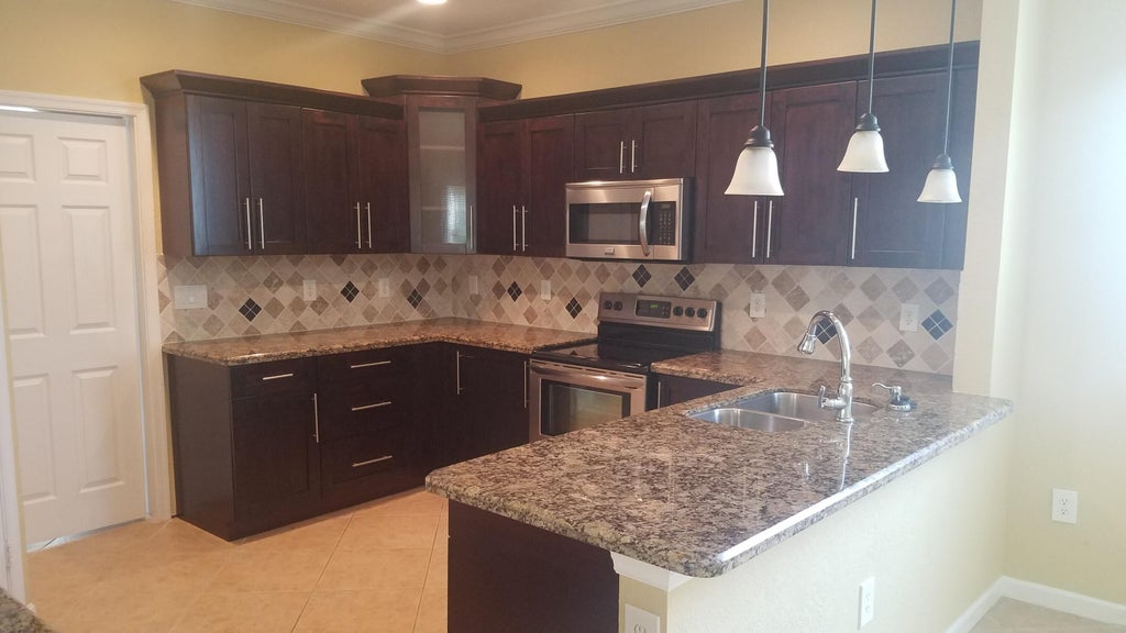 Photo of 1445 E Bexley Park Drive, Delray Beach, FL 33445 (MLS # B26059839)