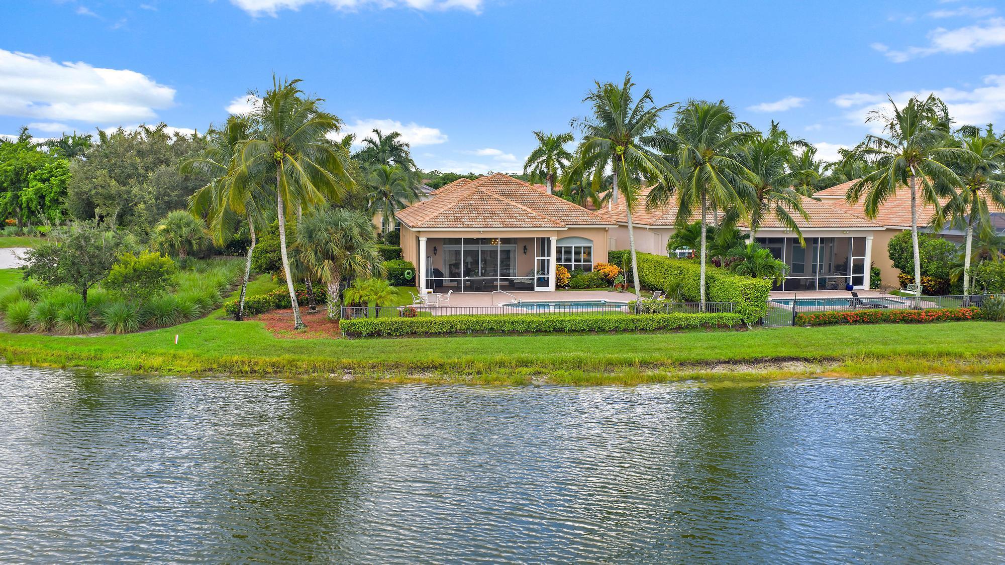 With sweeping water and golf views from nearly every room, this beautifully designed great room ''Monaco'' model sits on a premium corner lot in the highly desirable Terra Lago neighborhood of the award-winning Club at Ibis. Thoughtfully upgraded and meticulously maintained, the home has been enhanced with countless recent improvements, including a new HVAC system (2024), new hot water heater (2023), new flooring in the bedrooms and den (2023), custom window treatments (2024), plantation shutters (2025), and a full suite of new or upgraded appliances and pool equipment between 2023-2025. An all-new screened enclosure, freshly painted interiors, and garage upgrades--including overhead shelving and new flooring--add to its turnkey appeal. This residence showcases elegant details throughout: