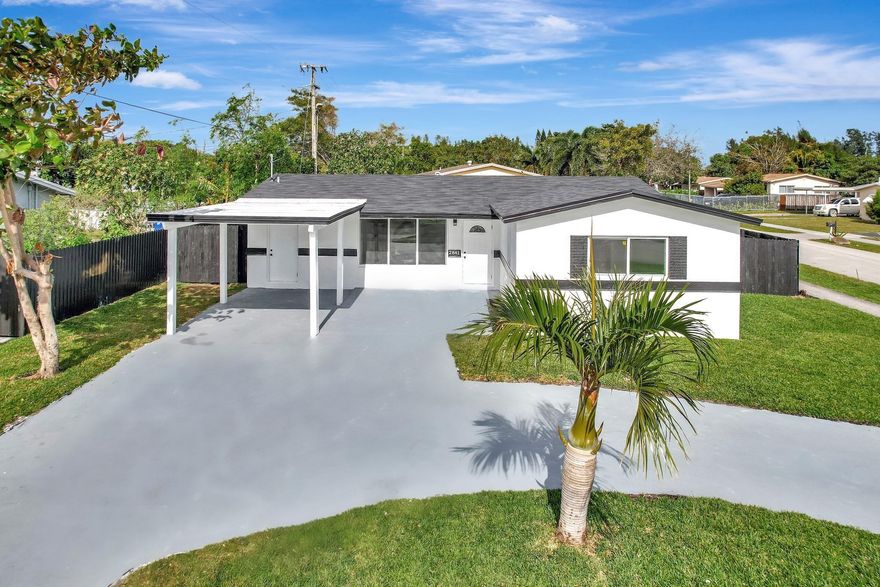 Welcome to your Luxurious Haven! Fully Renovated 3-Bedroom + Den, 2-Bathroom home on a fully fenced corner lot with NO HOA restrictions. Ideal for AIRBNB. Circular driveway w/carport fits 5+ cars. Near I-95 & Turnpike, 13 mins from Las Olas Downtown and 15 mins from the beach. Enjoy Energy Efficiency with a BRAND NEW black shingle roof, 4-ton Goodman A/C w/new duct work, and impact windows & doors. Modern finishes including 32-inch porcelain tiles, recessed lighting, and distinct fixtures. Custom open concept kitchen with new stainless steel appliances, soft close cabinets, a bar area, & quartz countertops. The master suite features multi-mood lighting, a walk-in closet, & luxury bathroom with a sleek glass shower. Large laundry room equipped w/NEW tankless water heater & washer/dryer set. Welcome to the epitome of sophisticated living in Fort Lauderdale! This meticulously crafted 3-bedroom plus den, 2-bathroom residence spans 1648 sq ft and is nestled on an oversized fully fenced 7200 sq ft corner lot, ensuring both privacy and security. With no homeowners association restrictions, you have the freedom to operate short term rentals and even store your boat or RV!Convenience meets elegance as this home is strategically located just 13 minutes from the bustling Las Olas downtown area and a mere 15 minutes from the pristine beaches. The exterior is adorned with a circular driveway featuring a carport, creating a grand entrance to your sanctuary.Step inside to discover the seamless blend of style and functionality. 32-inch porcelain tiles grace the entire living area, complemented by recessed lighting that adds an air of sophistication. Enjoy energy efficient amenities including a brand NEW 4-ton Goodman A/C, new duct work, impact windows and doors, and a sleek black shingle roof.The heart of this home lies in the fully upgraded kitchen, boasting all-new stainless steel appliances, custom 42-inch cabinets, a stylish bar area, and quartz countertops. Entertaining is a breeze in this open and inviting space.For the ultimate retreat, the master suite awaits with multi-mood recessed lights, a customizable walk-in closet, and an upgraded bathroom featuring a LED lighted vanity, luxury glass shower with a black accents, and distinct tiles.Completing the allure is a large separate laundry room with a brand NEW tankless water heater and washer/dryer set, adding convenience to your daily routine. This property is not just a home; it's a lifestyle upgrade – a harmonious fusion of comfort, style, and prime location. Welcome to your new sanctuary!
