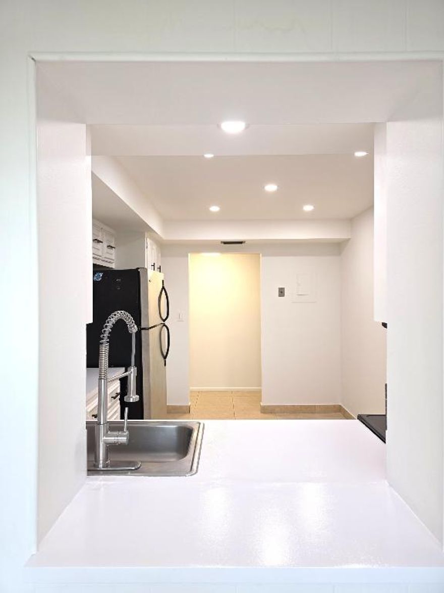 Updated second-floor unit in waterfront Three Islands community. Owner just painted the unit and added new ceiling with recessed lights, new kitchen counter, stove, microwave, sink and plumbing. New ceiling lamps in living room, den/office and bedroom, plus updated lighting in both baths. Bathtub and bath sinks professionally refinished. Flexible den works as office or guest space. Floor‑to‑ceiling windows, ceramic/tile floors and bright kitchen. Amenities include pool, tennis, fitness center, BBQ area, clubroom and 24‑hr security. Rent includes internet, TV and hot water. Minutes to beaches, dining, Gulfstream and Aventura.