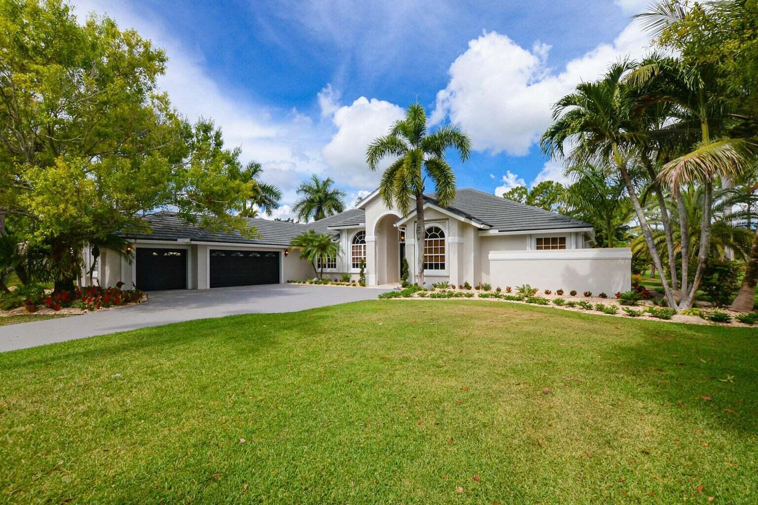 Spectacularly upgraded, elegantly designed property with heated pool nestled on a 1.15-ACRE site offering sweeping garden & lake views. Updated with spacious ceramic flooring blending perfectly with the fully renovated kitchen featuring appliances soft shut drawers, and striking marble. Opulence surrounds in this house with 5 bedrooms (the fifth bedroom functions great as an office or den), and 4 bathrooms styled with travertine, sleek counters and a soaking tub in the master. Feel like you're living in a private retreat and effortlessly step into this ultra-modern, yet welcoming estate, located on a scenic site. LUXURY AND PRIVACY AT ITS FINEST.