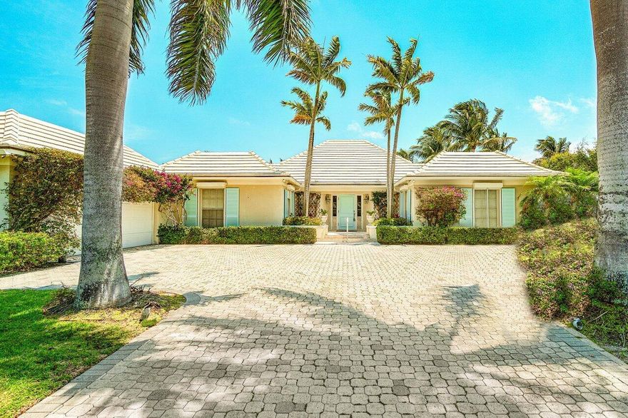 Welcome to 15 Spoonbill Road, an exquisite waterfront property located in the highly sought-after area of Manalapan, FL. Originally built in 1974, this stunning home was designed by the renowned architect Henry Harding and offers a unique blend of traditional and classic style. This impressive property features 3 bedrooms and 3 bathrooms, providing ample space for a family or guests. The interior boasts high ceilings and large windows that allow natural light to flood the space, creating a warm and inviting atmosphere. One of the most striking features of this home is its 112 feet of deep water frontage, private pool, and private dock.