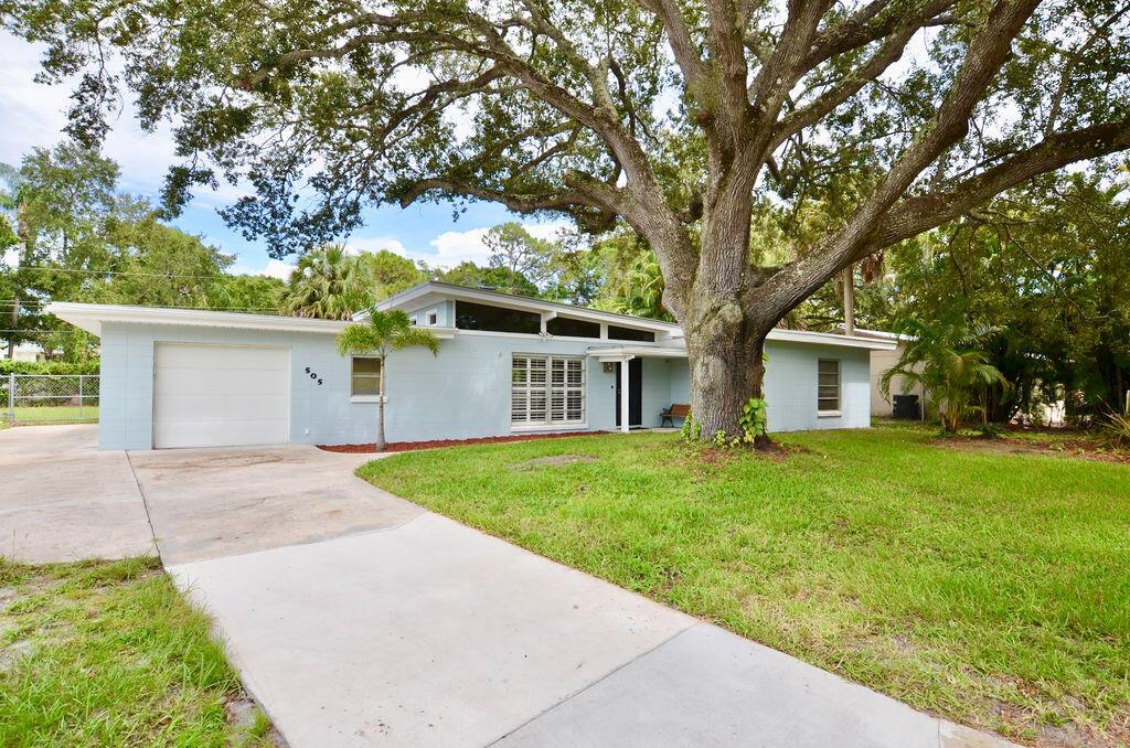 You will fall in LOVE! with this Charming Concrete Block Mid Century Modern home with 2017 Metal Roof, New A/C!. Move in ready. Brand new remodeled kitchen with quartz counters. Remodeled bathrooms.They don't make them like this anymore! Beautiful Wood beam ceilings, Brick Fireplace, Stunning Slate flooring in main areas and Luxury Vinyl Plank in bedrooms with built in closets. Garage is oversized with brand new washer and dryer and lots of storage space. There is a bonus room off the 3rd bedroom that could be used as a office, giant closet, or easily converted to a 3rd bathroom. Beautiful A/C'd Florida Room and Covered patio overlook your 11,326sf fenced yard. This is a quiet location that backs up to a preserve on the White City / River Park Border with County Only Taxes