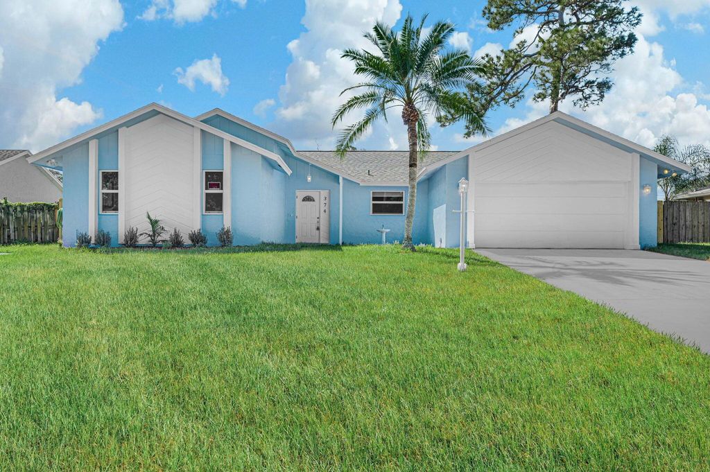Photo of 374 NE Greenbriar Avenue, Port Saint Lucie, FL 34983 (MLS # R11059416)