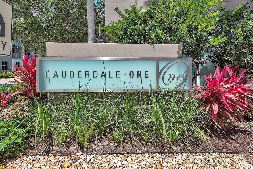 Large first floor 1/1 in desirable Lauderdale One. Small boutique building with only 174 units. This unit's location is ideal! Corner unit no one on either side of you. Right next to the parking garage door for convenience with groceries. NO need to have to go in an elevator. All the amenities are right outside your unit on the same floor. Unit has extra high ceilings, new laminate flooring, washer and dryer, stainless appliances, granite counter tops, impact windows & 1 covered assigned parking spot. This hidden gem has: manager on site, concierge, pool, spa, dry sauna, fitness center, business center, club room, guest suite & charging stations. Plenty of guest parking for your second car or motorcycle. Internet & pest control included. Pet friendly. Can rent first year. Twice a year.