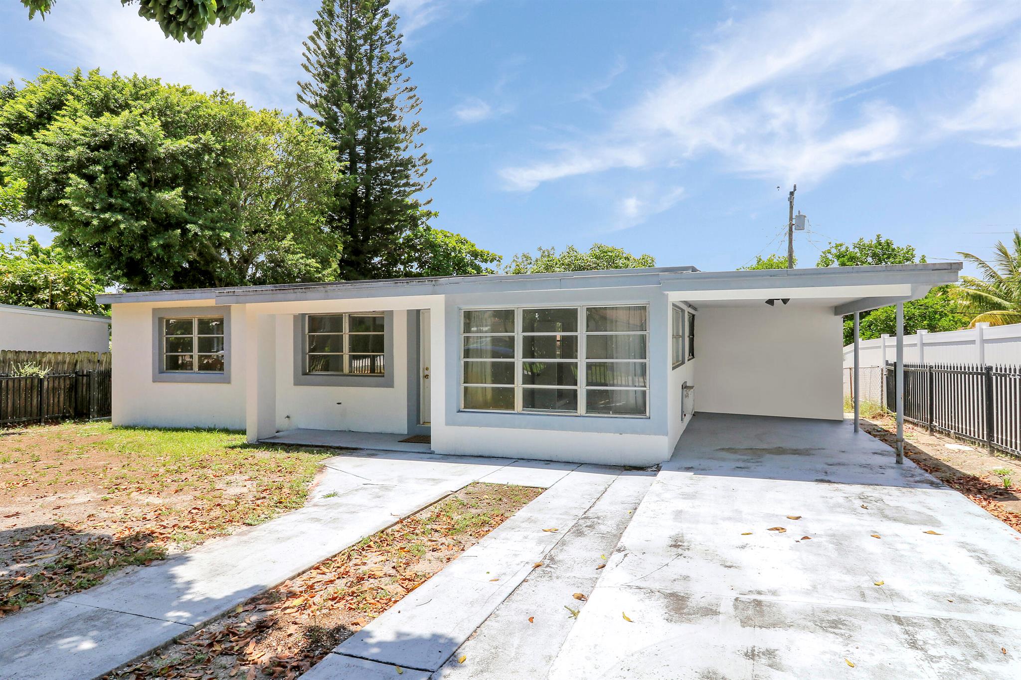 Prime West Palm Beach location. This 3-bedroom, 2-bath CBS home is just minutes from downtown, Palm Beach Island, The Park (Golf Digest Top 100 Public Course), the Palm Beach Zoo, and top local dining. Features include a brand-new A/C, CBS construction, and an expansive, fully fenced yard that offers endless potential--ideal for entertaining, gardening, or adding a pool. Don't miss this versatile opportunity in the heart of it all with no HOA. Schedule your private tour today.