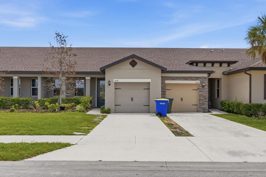 Seller motivated! Beautiful one-story home featuring a bright open floor plan with 2 bedrooms and 2 full baths. The upgraded kitchen offers stainless steel Whirlpool® appliances, quartz countertops, a center island, and elegant 42" white cabinets with crown molding. Enjoy stylish new flooring throughout—no carpet. The spacious primary suite includes a walk-in closet and peaceful lake views. Additional highlights include a laundry room, attached garage, covered front porch, and landscaped yard. Located in Celebration Pointe with amenities including a pool, walking paths, and a future clubhouse, all in a prime, convenient location.