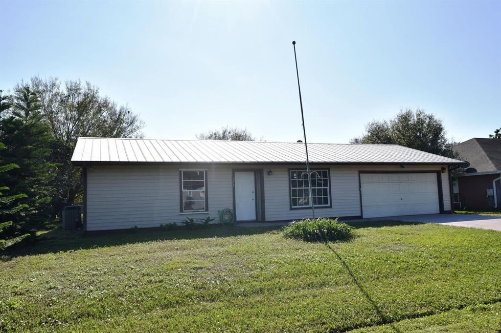 Photo of 574 NW Azine Avenue, Port Saint Lucie, FL 34983 (MLS # R10741205)