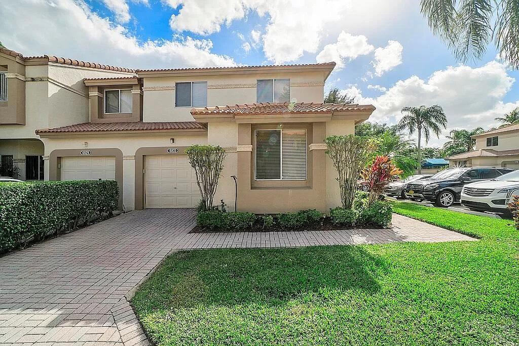 Rarely available spacious END unit town home in the manned gated community of Boca Pointe! Live the Florida lifestyle in this town home that lives like a single family home in an ideal location near the community pool. It is light and bright with an extra large outdoor screened patio, grass area behind and a 1 car garage. The entire first floor is tiled with a spacious main living space, dining room that opens to the living room and an ample eat in kitchen with loads of cabinets. There is an indoor laundry room, huge primary bedroom, 2nd floor completely tiled, gorgeous updated master bath with dual sinks, large walk in closet and large guest bedrooms. Club memberships available but not mandatory. 1 pet under 25 pounds permitted.