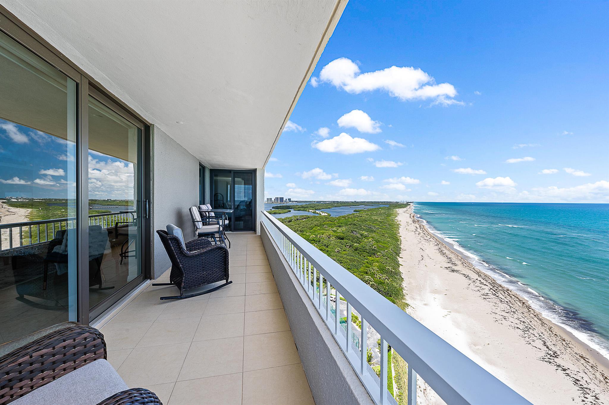 Escape this coming winter with panoramic views surrounded by gorgeous blue & turquoise water overlooking the ocean to the east, John MacArthur State Park just north with a wrap around balcony facing south. This light and bright corner residence has incredible water views from every room with floor to ceiling impact glass windows and slider doors, tile floors throughout, updated kitchen & baths with granite counter tops. Relax watching the boats cruise by while enjoying dining & drinks on your balcony surrounded by wide open views everywhere! This property boasts some of the best views on Singer Island! See Supplement...