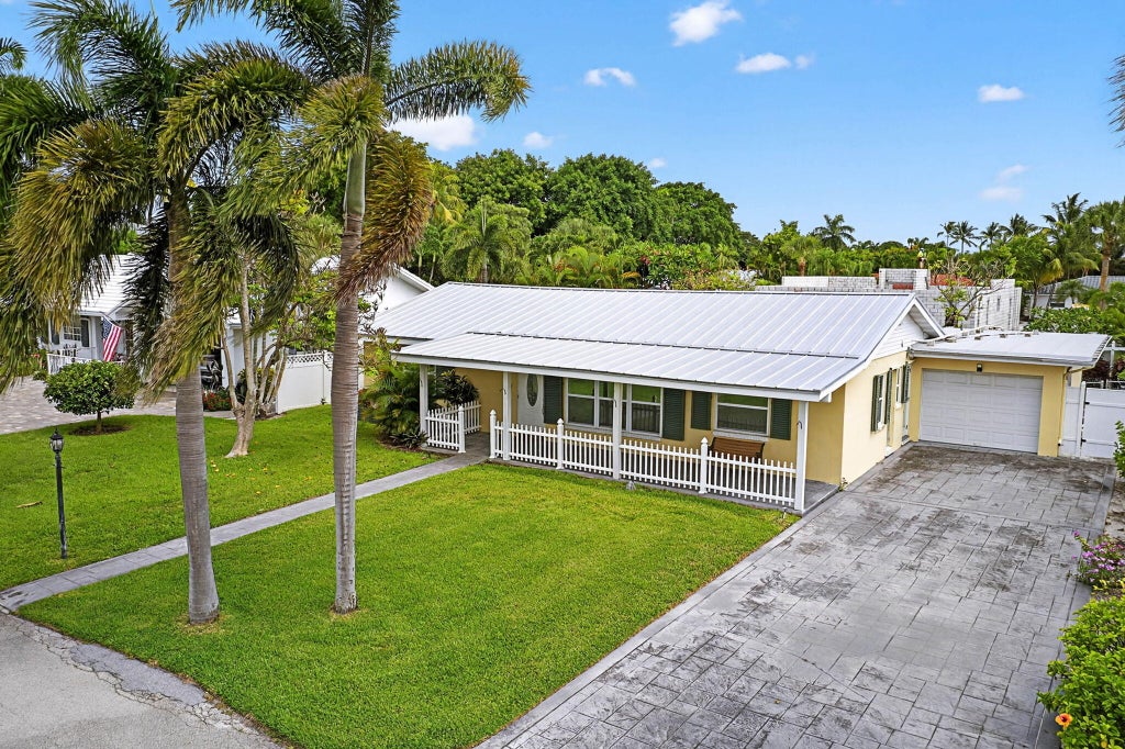 Photo of 310 Tacoma Lane, Palm Beach Shores, FL 33404 (MLS # R11106789)