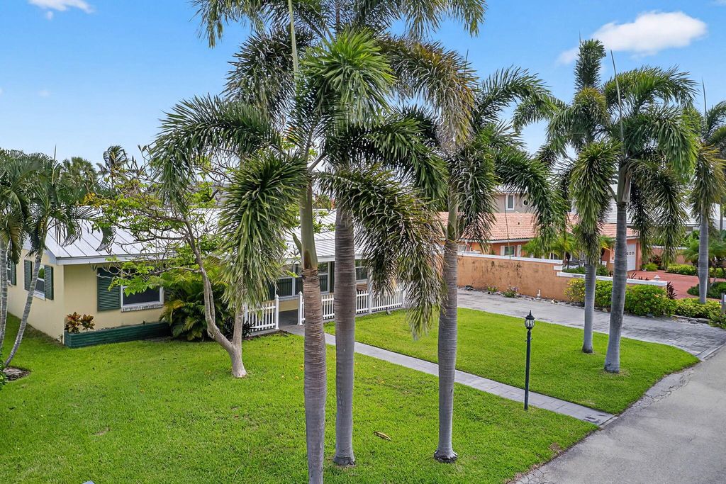 Photo of 310 Tacoma Lane, Palm Beach Shores, FL 33404 (MLS # R11106789)