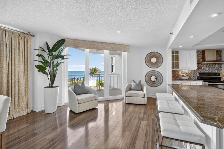 Welcome to your beachfront oasis ''on the sand''! This stunning 3 bedroom condo in Ocean Dunes boasts breathtaking Atlantic views, a modern open floor plan, warm laminate flooring, sleek white kitchen, stainless steel appliances, gorgeous granite counters. Freshly painted, new luxury carpet in all bedrooms, impact glass throughout- it's move-in ready. Enjoy the spacious great room flooded with natural light and ocean views, and a private balcony perfect for morning coffee or dining al fresco. This exclusive 48 unit boutique building offers direct beach access-just step outside-renovated common areas, manned security, pool, fitness room, and social room. Park in the garage and take the elevator to your private foyer entry. Milestone inspection done, SIRS done-your coastal dream home awaits