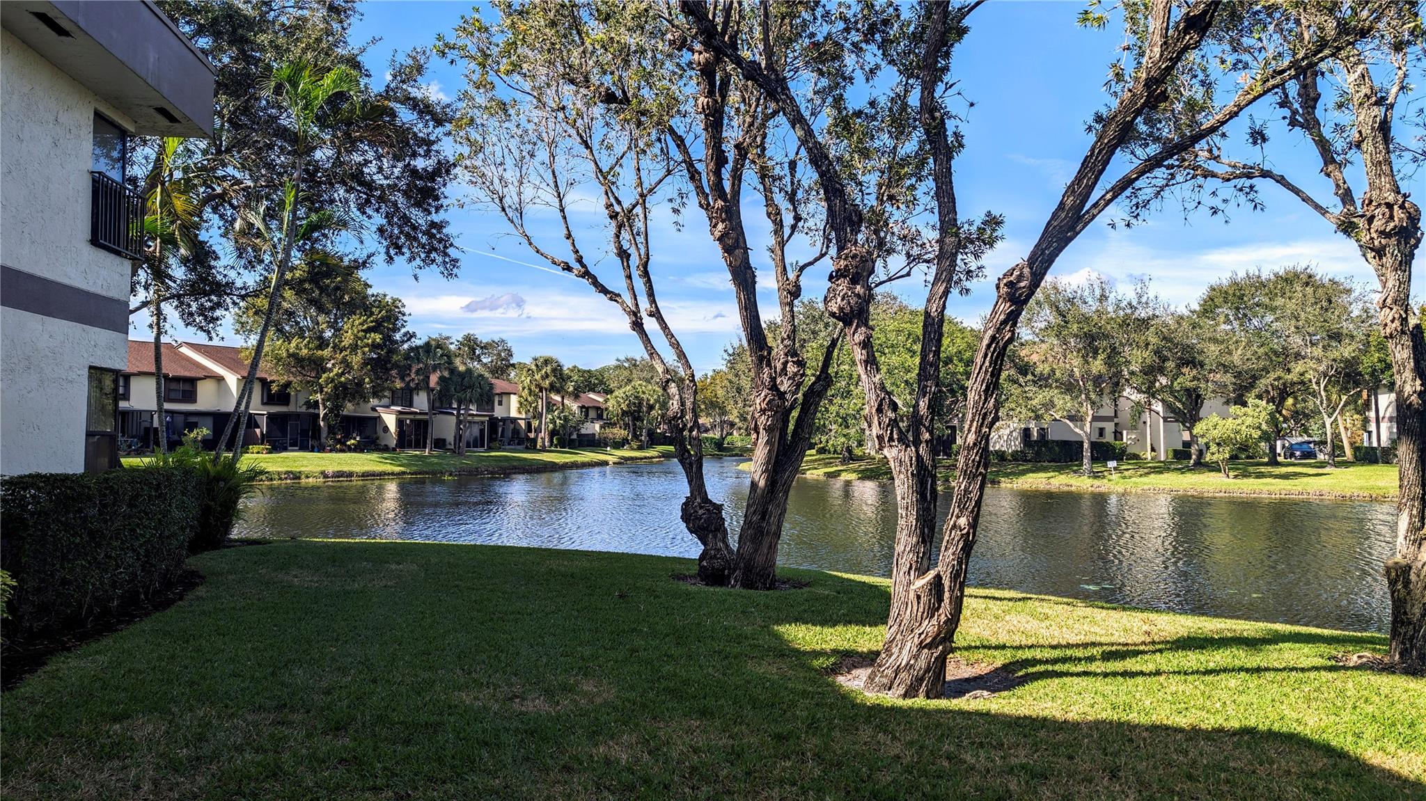 SELLER MOTIVATED!!!. ...Stunning lake views grace every room of this impeccably remodeled two-bedroom garden condo on the first floor. Brand New Roof, A/C - 2019, 40 Gallon Hot Water Heater - 2020. Sliding glass doors lead to a spacious porcelain-tiled patio, a serene retreat overlooking the lake. Revel in the luxury of porcelain tile flooring throughout, complemented by a fully remodeled kitchen and bathrooms. The kitchen boasts stainless steel appliances, including a French door fridge, while the laundry area features a full-size top-load washer and front-load dryer. Enhanced by roll-up shutters, the patio is a versatile space. Don't miss this must-see property with amenities catering to all ages.....ALL FURNITURE NEGOTIABLE....REALTORS SEE BROKER REMARKS