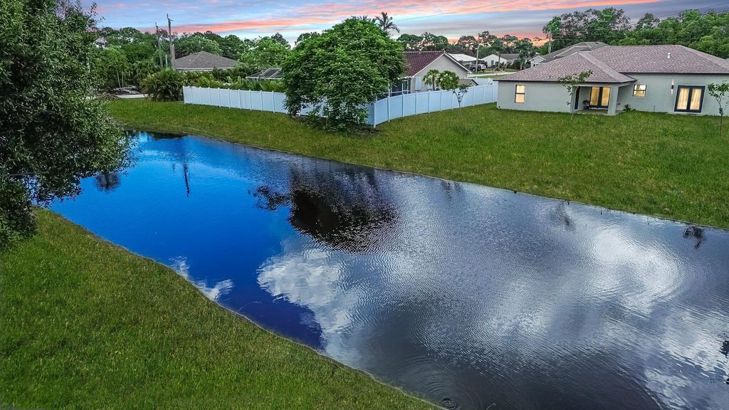 Photo of 2213 SE Rock Springs Drive, Port Saint Lucie, FL 34952 (MLS # R11117768)