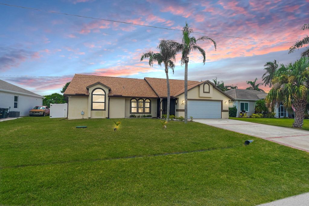 Photo of 2213 SE Rock Springs Drive, Port Saint Lucie, FL 34952 (MLS # R11117768)