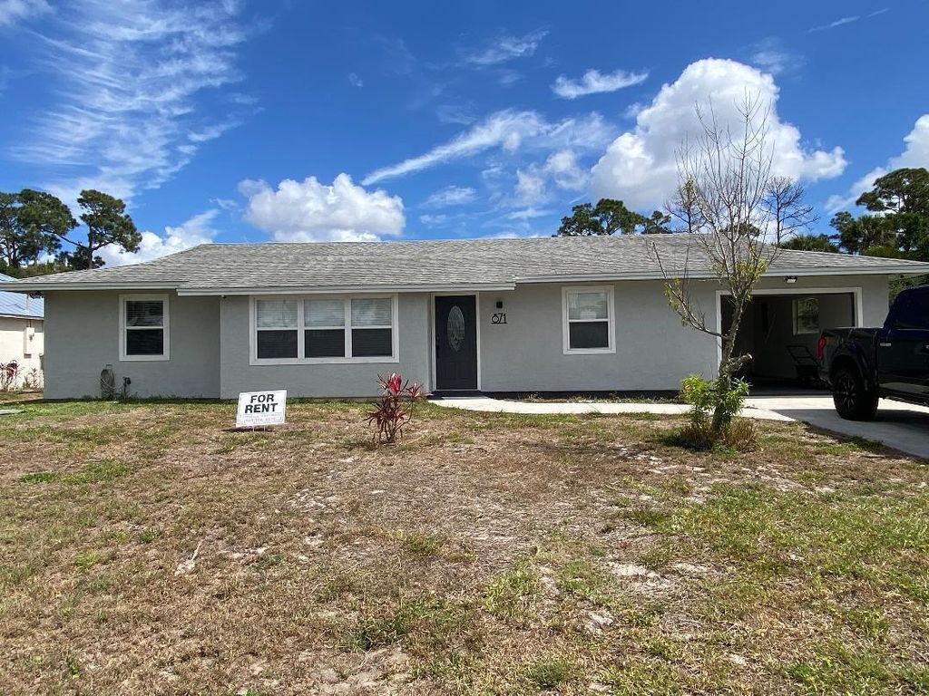 Photo of 871 SW Dalton Avenue, Port Saint Lucie, FL 34953 (MLS # R11139293)