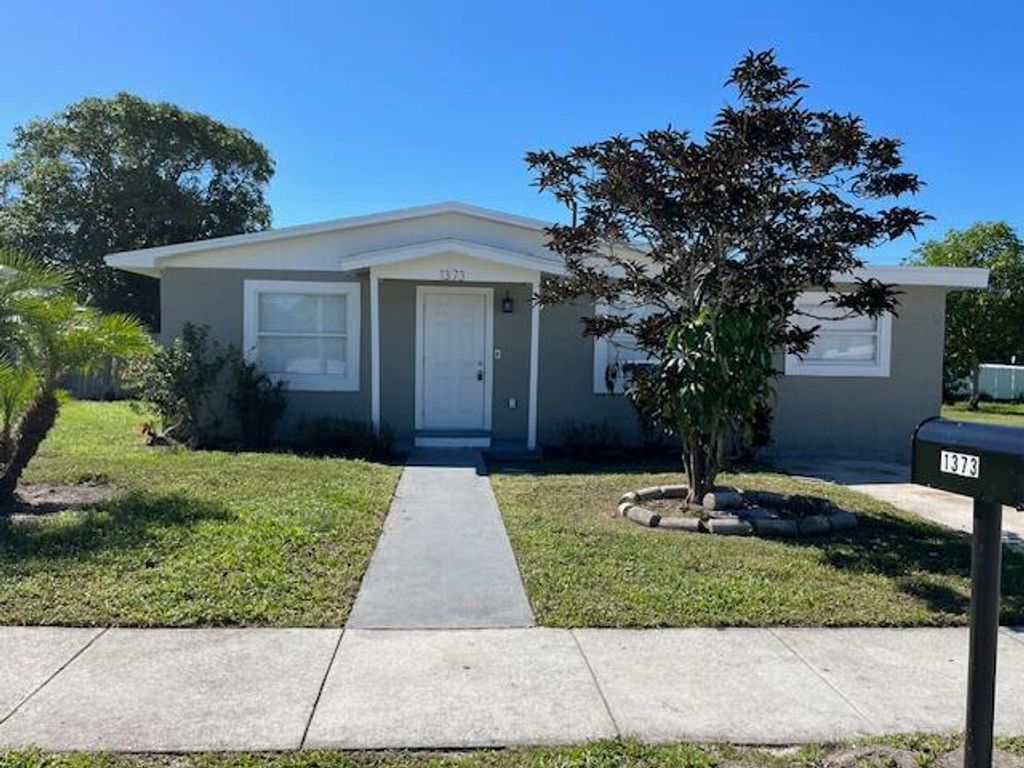 Photo of 1373 W 30th Street, Riviera Beach, FL 33404 (MLS # B26005803)