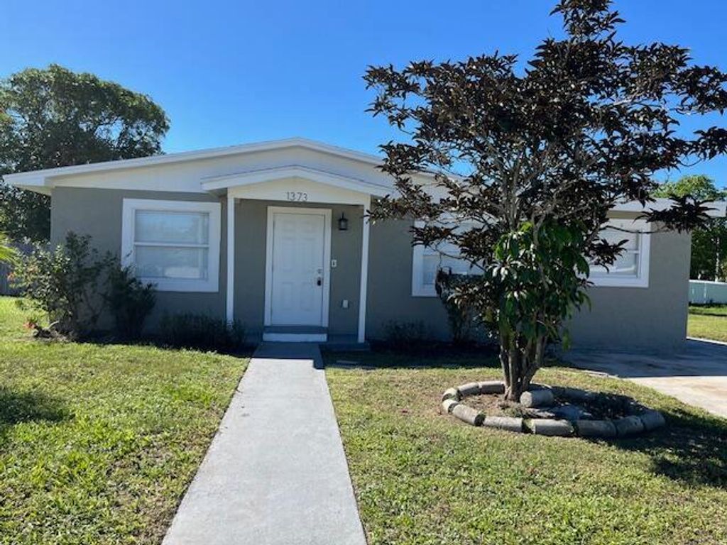 Photo of 1373 W 30th Street, Riviera Beach, FL 33404 (MLS # B26005803)