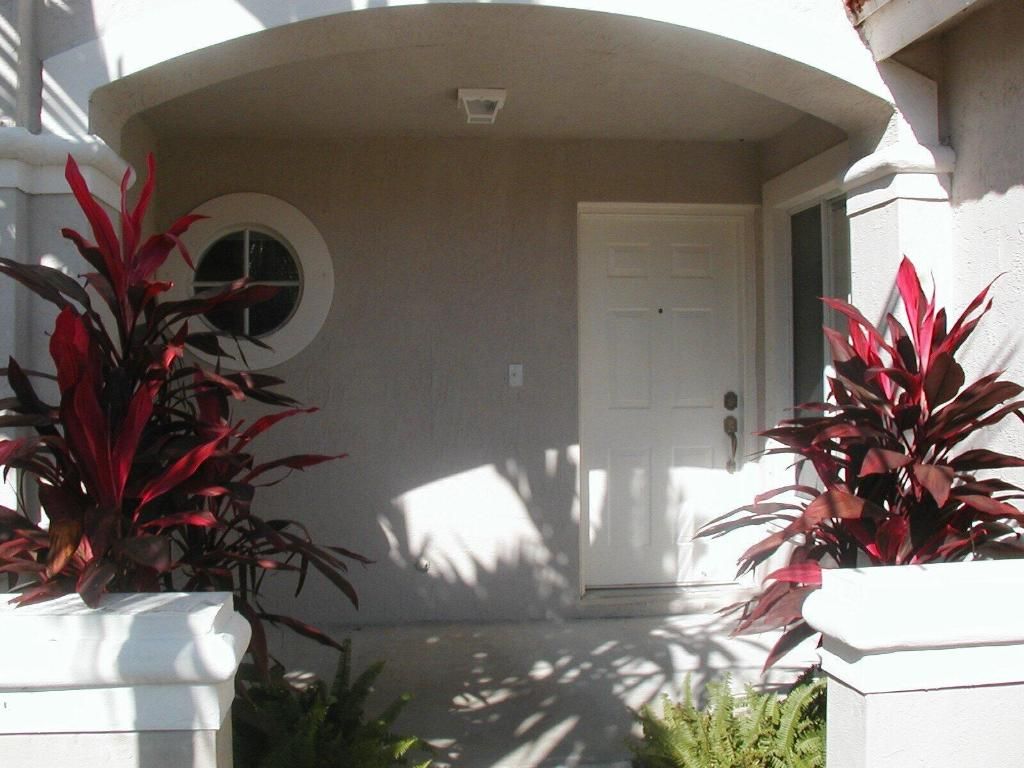 Photo of 7052 Hawks Nest Terrace, Riviera Beach, FL 33407 (MLS # R11115141)