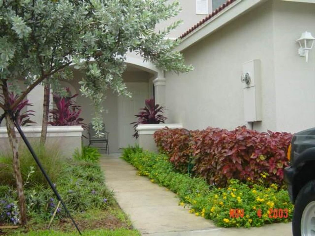 Photo of 7052 Hawks Nest Terrace, Riviera Beach, FL 33407 (MLS # R11115141)