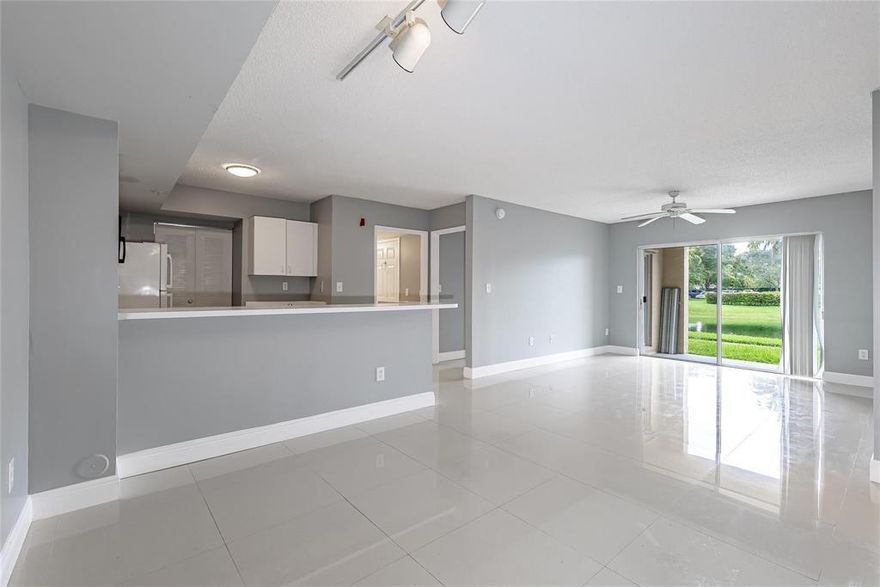 Available JULY 1st, 2026.  Updated 2/2 Condo on the Lake | Prime Davie Location |  2BR/2BA condo with stunning lake views and porcelain floors throughout. Fresh designer paint, in-unit washer/dryer, and a split bedroom layout — perfect for roommates or tenants. Major mechanicals already updated: A/C handler (2022) and water heater (2021). The community has undergone a complete transformation — new roof (2022), freshly painted exteriors, and a brand-new clubhouse featuring a fully equipped gym, lounge with TV and kitchen, resort-style pool, indoor paddleball, billiards room, dog run, and basketball and tennis courts. HOA covers water, waste, common grounds, and insurance. Unbeatable location steps from Nova Southeastern University, Broward College, and UF Davie campus Tremendous location Updated unit well cared for available July 1st 2026