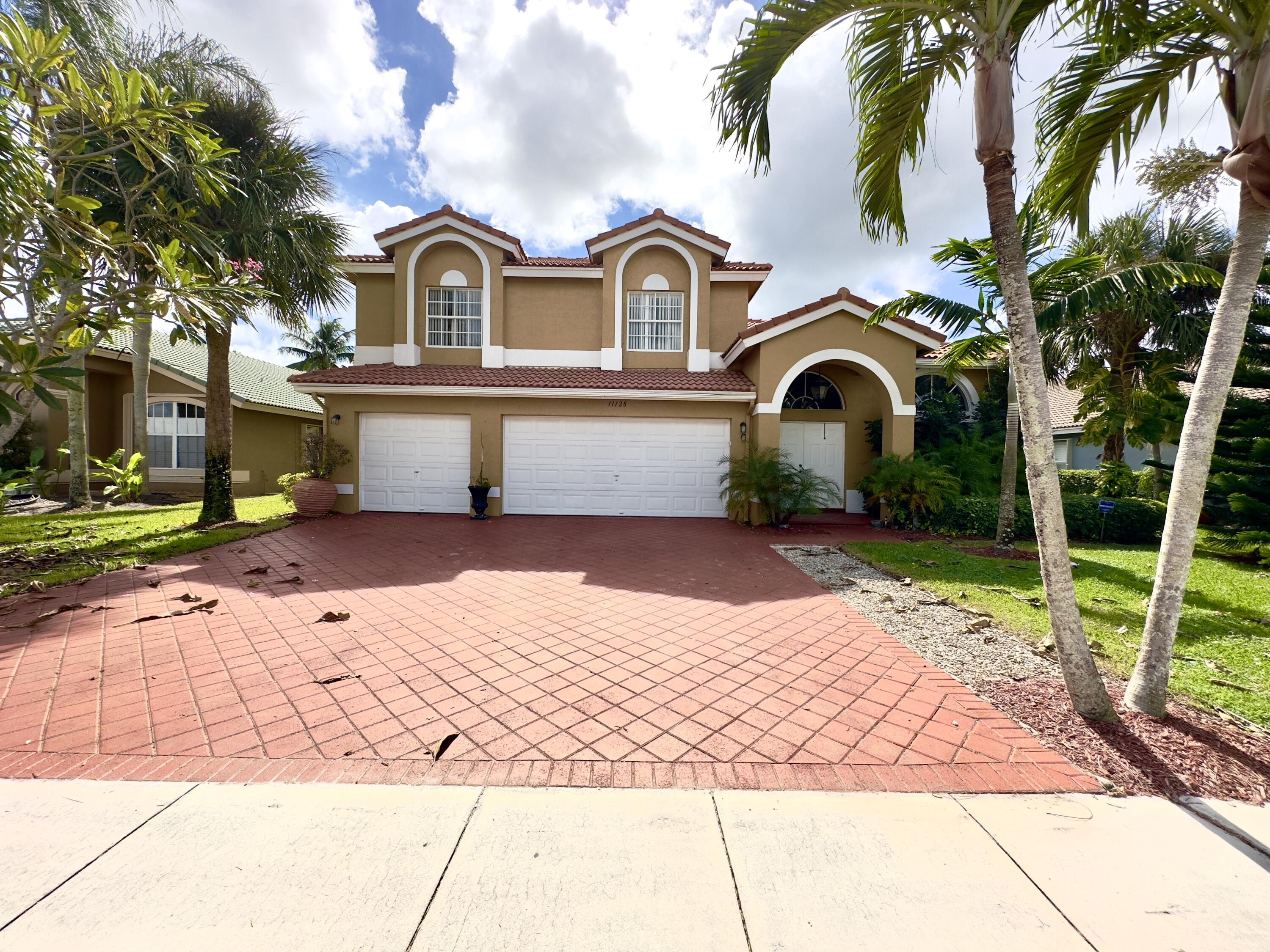 Beautiful 5 bedroom, 3 bedroom house in the heart of Wellington at Grand Isles. Sprawling living areas with tile and luxury vinyl plank flooring throughout. Large kitchen with granite, stainless and island. Large outside screened in patio with ceiling fans and expansive lake views and lots of grass area. Located close to Equestrian events and A rated schools. Gated community with resort style amenities like pool, clubhouse and fitness center. Come and see this wonderful home today!