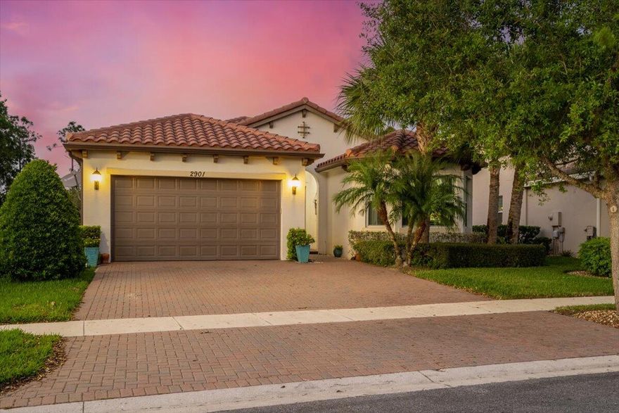 This beautiful home in the charming community of Portosol is a dream come true. From the moment you're driving through the gated community, to when you pull up to your extended driveway, you'll feel like you've made it! Standing in the open concept kitchen, your guests will be impressed with the large island, double wall ovens, cook top, granite counters and tall ceilings. Exit through the screened in patio to enjoy a fire pit on cool Spring evenings. With 3 bedrooms and a den that could be converted to a bedroom, there is plenty of room. The spare bedrooms and bathroom feel like their own cozy nook with a pocket door that company or household members can close for added privacy. You'll be impressed with the size of the master bedroom that is large enough for a reading nook under the windows. The master bathroom has dual sinks and a rainfall shower head in the oversized walk in shower. Plus, a separate water closet. Just minutes from all the shops, entertainment and restaurants you could wish for. Plus, close to the PBI airport and a short drive to the beach.