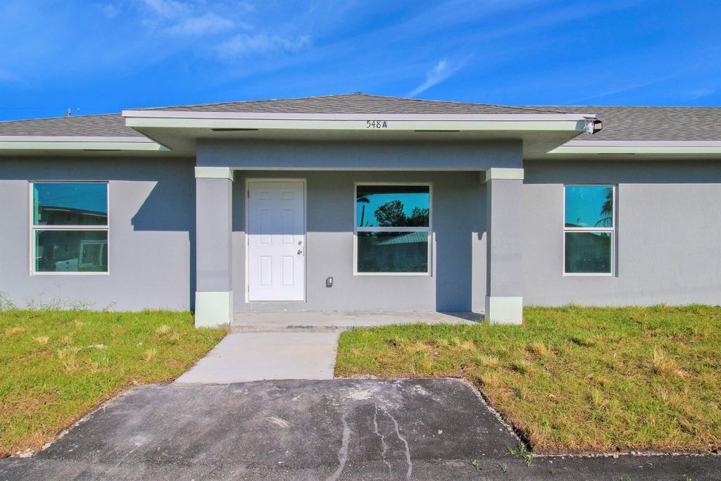 Photo of 548 SW 5th Street #A, Belle Glade, FL 33430 (MLS # R10976784)