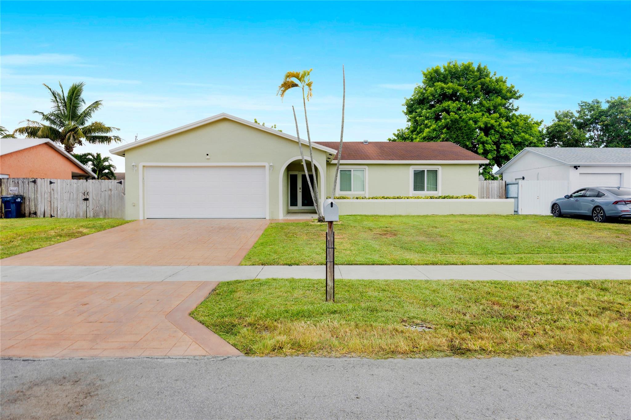 Discover this fully renovated 3 bedroom, 2 bathroom home in a nice, quiet neighborhood - a rare find with NO HOA and one of the few homes in the area featuring a Large Sparkling Pool. Inside, a bright, open and airy layout features new flooring and a gourmet kitchen with granite countertops, stainless steel appliances, and custom cabinetry. Bathrooms offer stylish, quality upgrades. Full Impact Windows and Doors provide peace of mind. Enjoy the paver patio leading to the pool and a spacious fully fenced backyard. Large 2 car garage with new epoxy floor and a wide paver driveway with room for plenty of parking. Perfectly located near highways and shopping. Move-in-Ready for the best of Florida living.