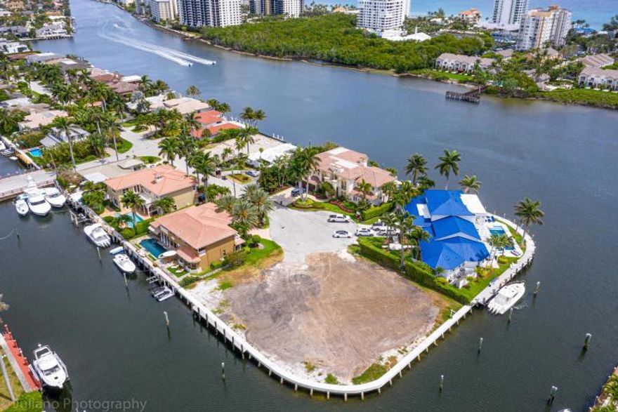 A boater's dream! Point lot with over 260 ft. of  deep water frontage with south and protected west dockages. Build your dream home on this 17.251 sq. ft. lot ( one lot in from the intercoastal waterways) with wide canals to easily maneuver large boats