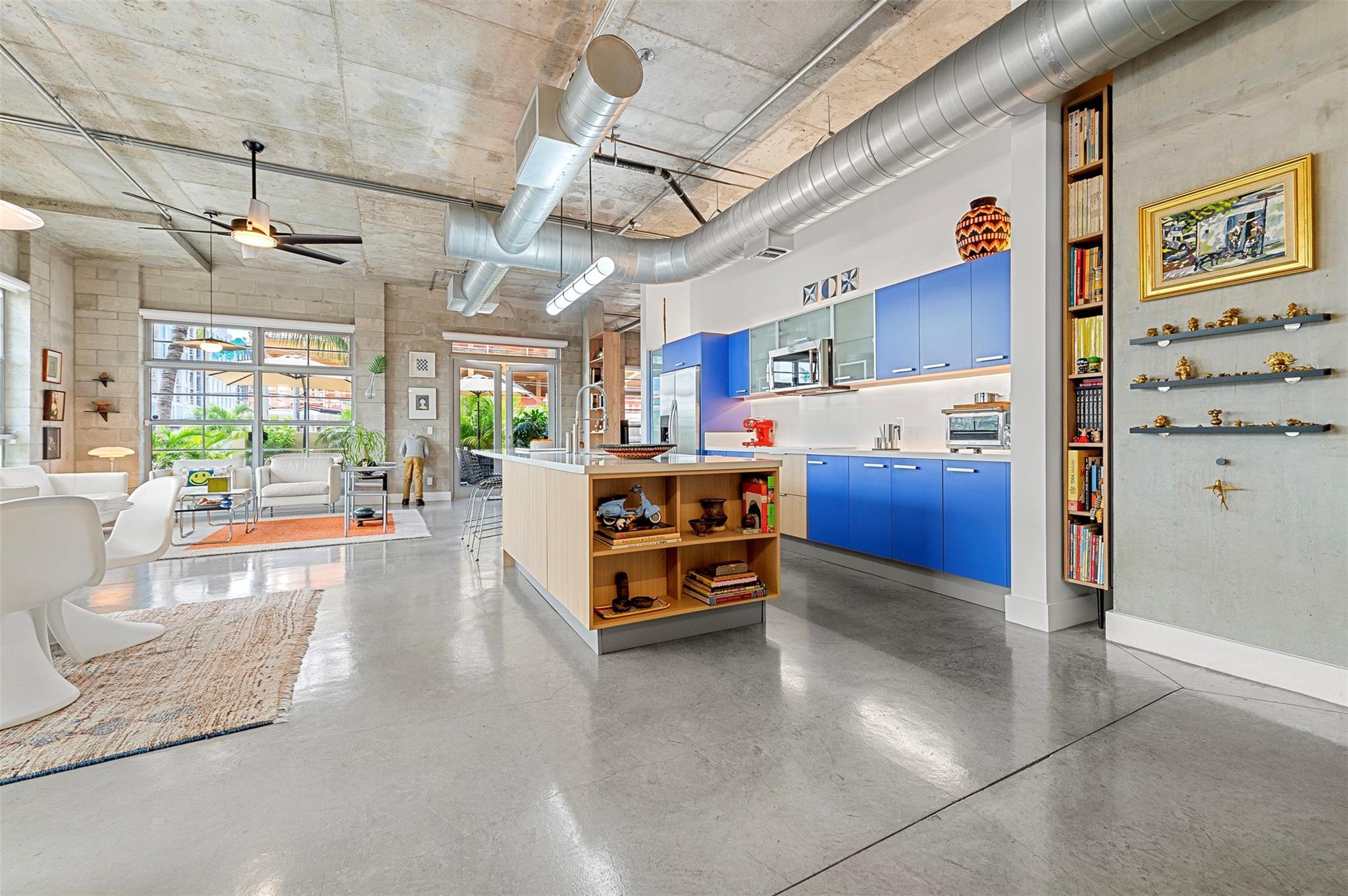 The most incredible Loft on the market in Fort Lauderdale today. Industrial meets high style along with a true South Florida lifestyle featuring an outdoor garden space of over 400 square feet. Bright space with huge impact windows. Two Bedroom Two Bath designed as flexible spaces with one used as a home office & den. Custom cabinetry throughout creates extra storage beyond the built-out closets. Electronic window coverings make it easy to close the entire space when you're not there and open it quickly to enjoy the incredible garden. The garden space is artfully planted and creates a sanctuary that is not to be believed. There is water on the balcony making for easy upkeep. Welcome to the finest of Flager Village, close to the Brightline and all downtown Fort Lauderdale has to offer.