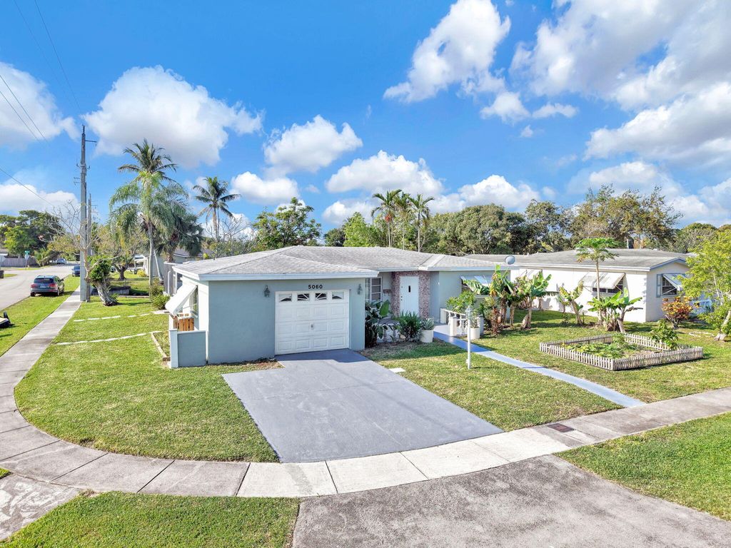 Photo of 5060 NW 41st Court, Lauderdale Lakes, FL 33319 (MLS # B26007336)