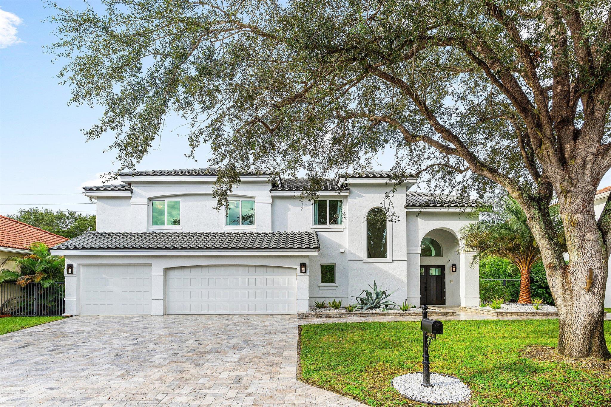 Welcome to this fully renovated 5BR, 2.5BA home in Boca Raton's coveted Mission Bay. Offering 2,341 sq ft living (2,981 total), a 3-car garage, and full impact windows, it blends modern luxury with everyday comfort. Highlights include soaring ceilings, wood-look tile, and a chef's kitchen with quartz counters, island seating, and high-end appliances. Upstairs, the primary suite boasts a spa-style bath with soaking tub and frameless shower plus 4 bedrooms. Outside, a heated saltwater pool/spa, marble patio, summer kitchen, and pergola create a private retreat. Mission Bay residents enjoy resort amenities--clubhouse, fitness, tennis, pickleball, pool, tiki bar--plus exclusive discounts at Evert Tennis Academy and Boca Prep. Minutes to top schools, parks, shopping, dining, and beaches.