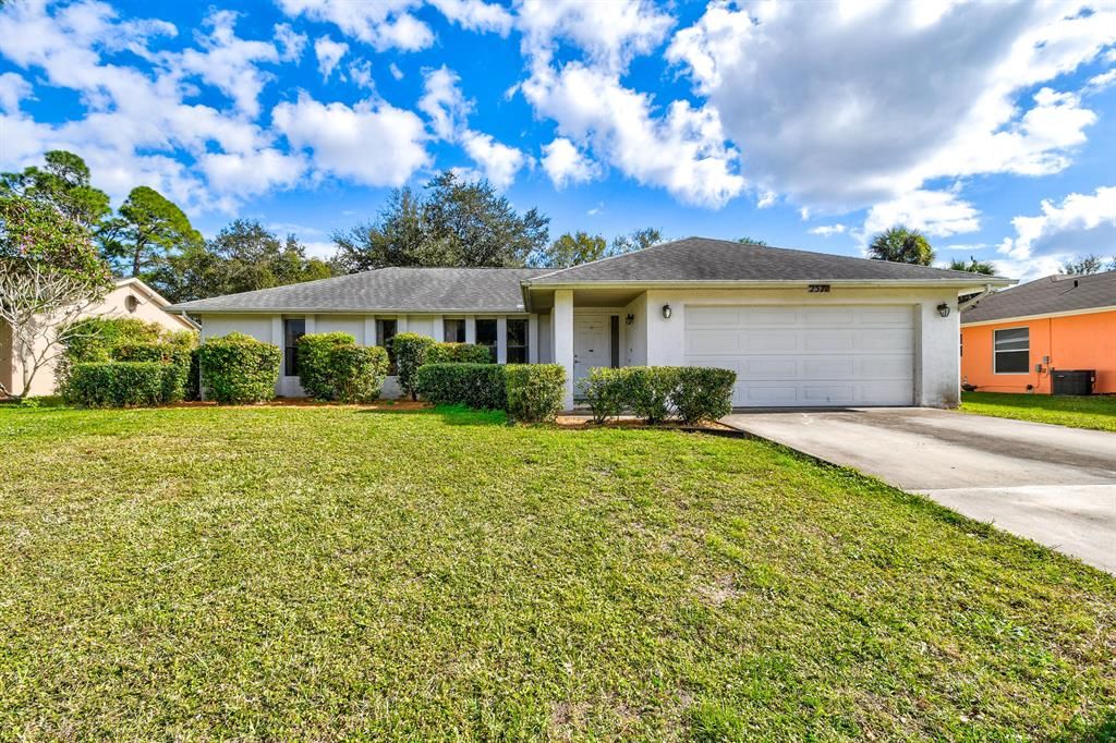 Photo of 2571 SW Mcdonald Street, Port Saint Lucie, FL 34953 (MLS # R10682462)