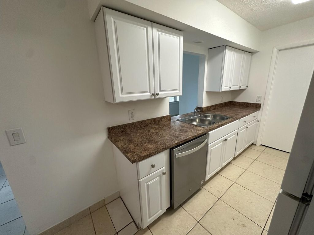 Photo of 132 SW Crescent Avenue, Port Saint Lucie, FL 34984 (MLS # R11058245)