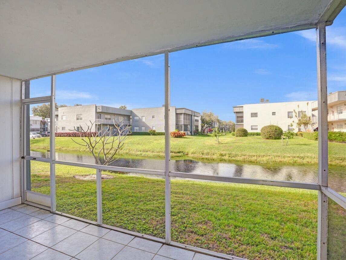 Welcome to 298 Burgundy D--a beautifully updated and fully furnished condo in the heart of Kings Point, an active 55+ community in Delray Beach.This freshly painted corner unit offers added privacy and extra windows, flooding the space with natural light and creating a bright, airy feel throughout. Enjoy serene canal views from your screened-in patio, which includes a washer and dryer and an additional storage closet--a perfect blend of indoor comfort and outdoor relaxation.The kitchen has been updated with granite countertops, and both bathrooms have been tastefully renovated. Other features include a 2017 AC, 2018 water heater, and GE electrical panel.Located just steps from the mailbox and close to the community pool exclusive to Burgundy residents.