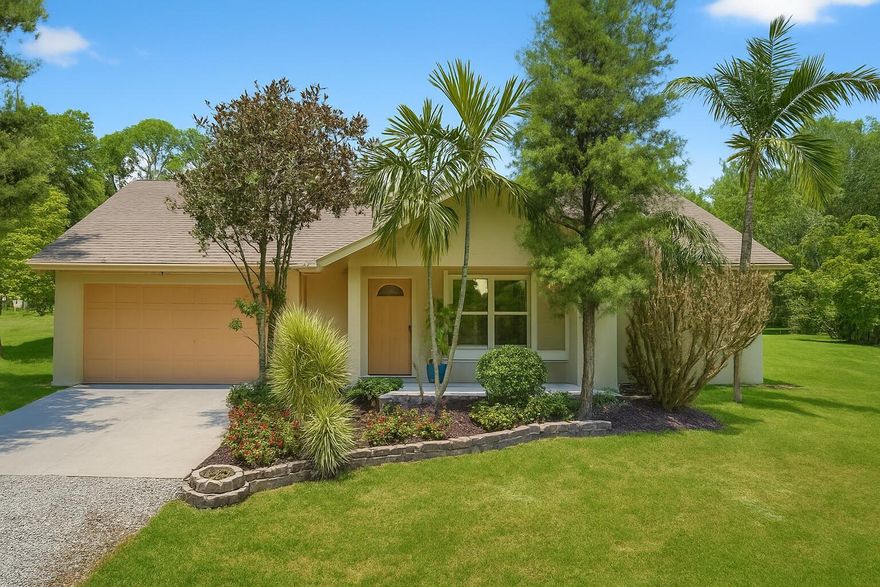 Welcome to your private retreat in the heart of Loxahatchee! This charming 3-bedroom, 3 bath single family home sits on over an acre of land, offering plenty of space to spread out and enjoy nature. The home features NEW floors; fresh paint; a spacious split floor plan; updated kitchen with stainless steel appliances; and large windows that fill the space with natural light. Enjoy peaceful mornings on the covered front porch and take in the serene surroundings.The oversized lot offers ample parking, room for RV or boat storage, and endless potential for outdoor entertaining or gardening. Located on a quiet street with no HOA, this property provides both privacy and freedom--all while being just a short drive from shopping, dining, and top-rated schools.