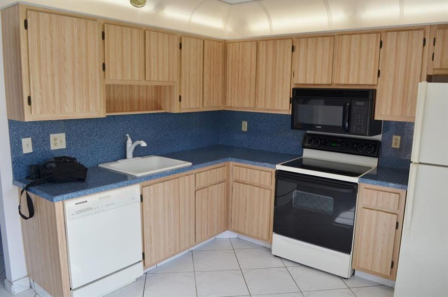 True 3/2 end unit Villa with level finished family room in super desirable Viburnum HOA in Las Verdes. Tile on diagonal throughout the living areas, updated AC System less than 2 yrs old, full Accordion Hurricane shutters. Screened patio off Kitchen, updated wiring and extra storage closet added (can easily be removed if needed). Walking distance to satellite pool and new Pickleball Courts. Super quiet section that's well run & maintained. Best Value in Delray Beach.