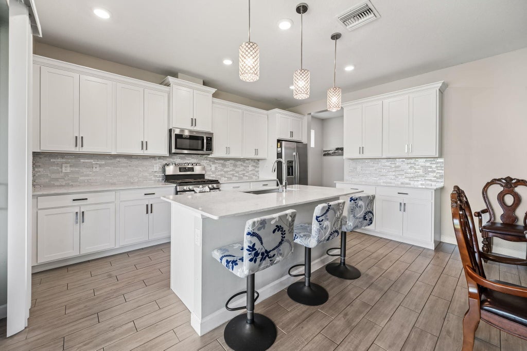 Photo of 1408 Wandering Willow Way, Loxahatchee, FL 33470 (MLS # B26041504)