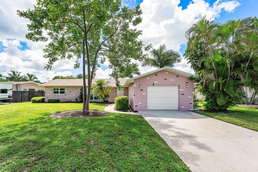 Photo of 128 Sandpiper Avenue, Royal Palm Beach, FL 33411 (MLS # B26080552)
