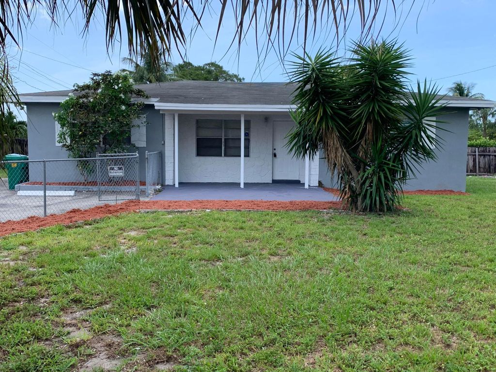 Photo of 240 NW 38th Avenue, Lauderhill, FL 33311 (MLS # B26042648)