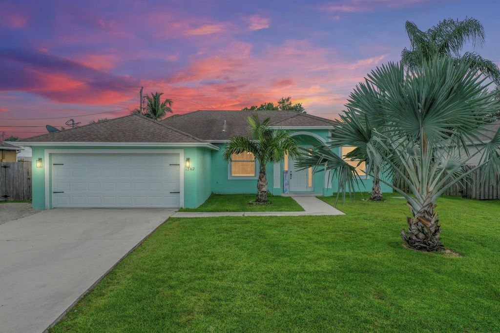 Photo of 1742 SW Commerce Avenue, Port St Lucie, FL 34953 (MLS # R10906179)