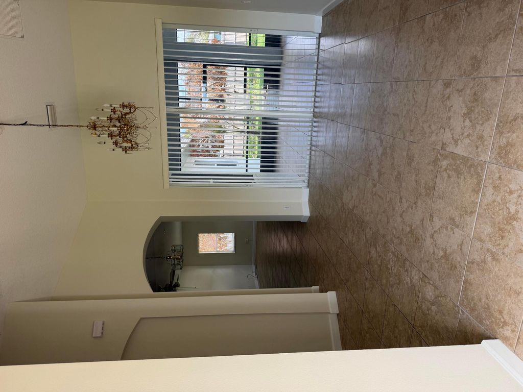 Photo of 787 SE Evergreen Terrace, Port Saint Lucie, FL 34983 (MLS # B26011499)